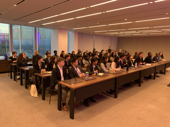 The Lionsbridge student cohort listens to an alumni speaker at the KKR site visit